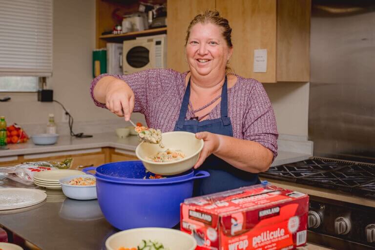 alt='cook making pasta salad'