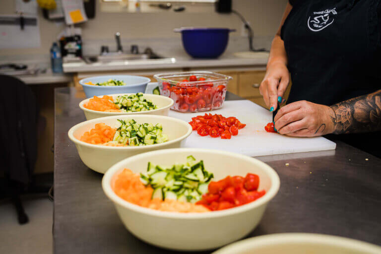 alt='cook cutting fresh vegetables' '