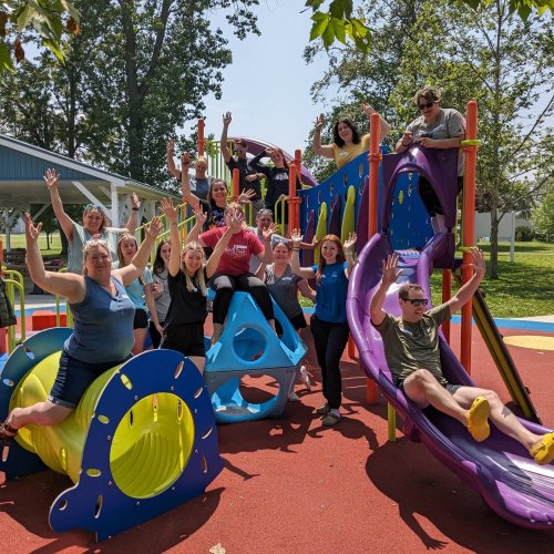 alt='day camp team at the park'